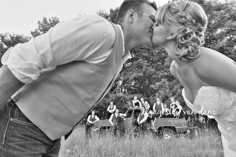 Wedding Party framed by kiss