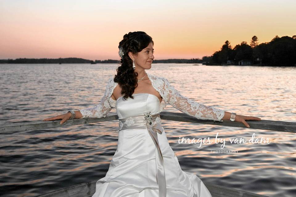 Bride on dock at sunset