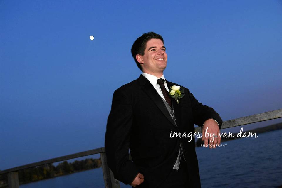 Bride on dock at sunset