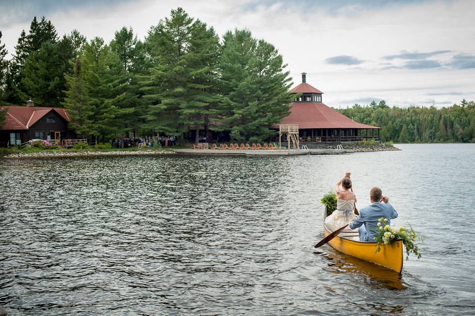 Bride canoeing to ceremony