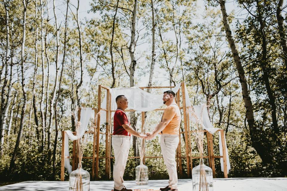 Grooms Kiss at Head Table