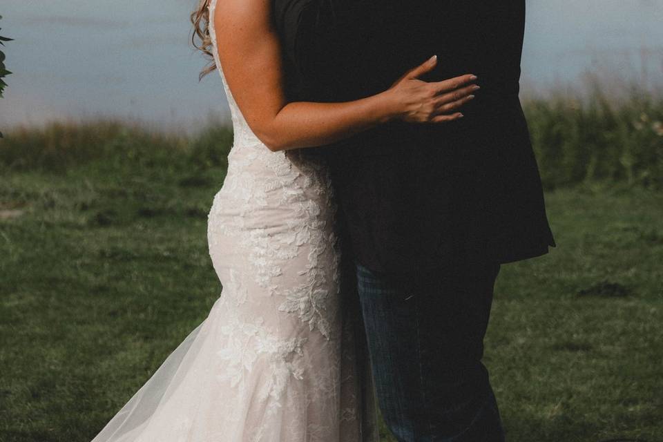 Kissing in front of lake
