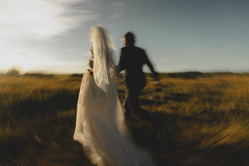 Wedding couple running