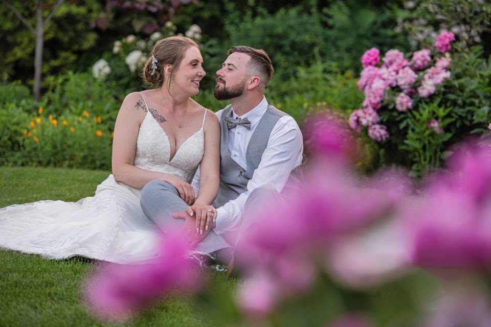 Sitting next to each other on the grass