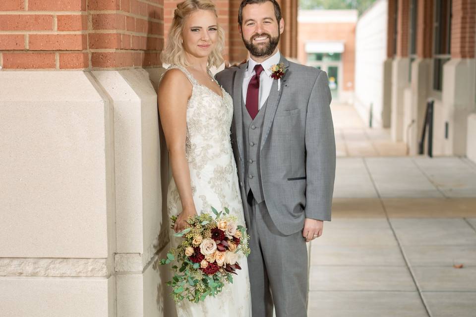 Bride and groom pose for photo