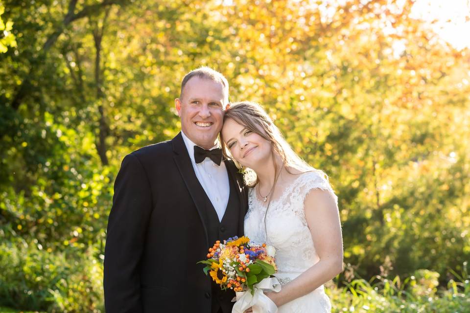 Bride leans her head on groom