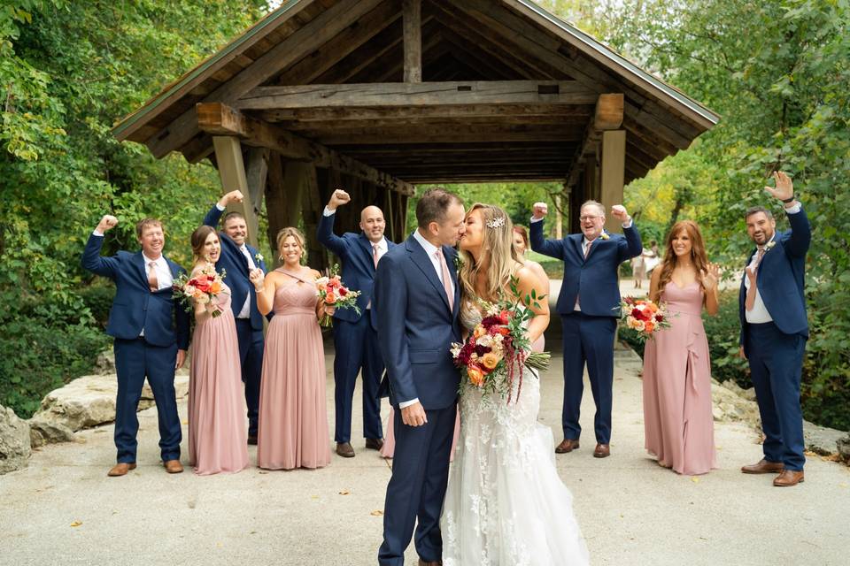 Couple kisses as people cheer