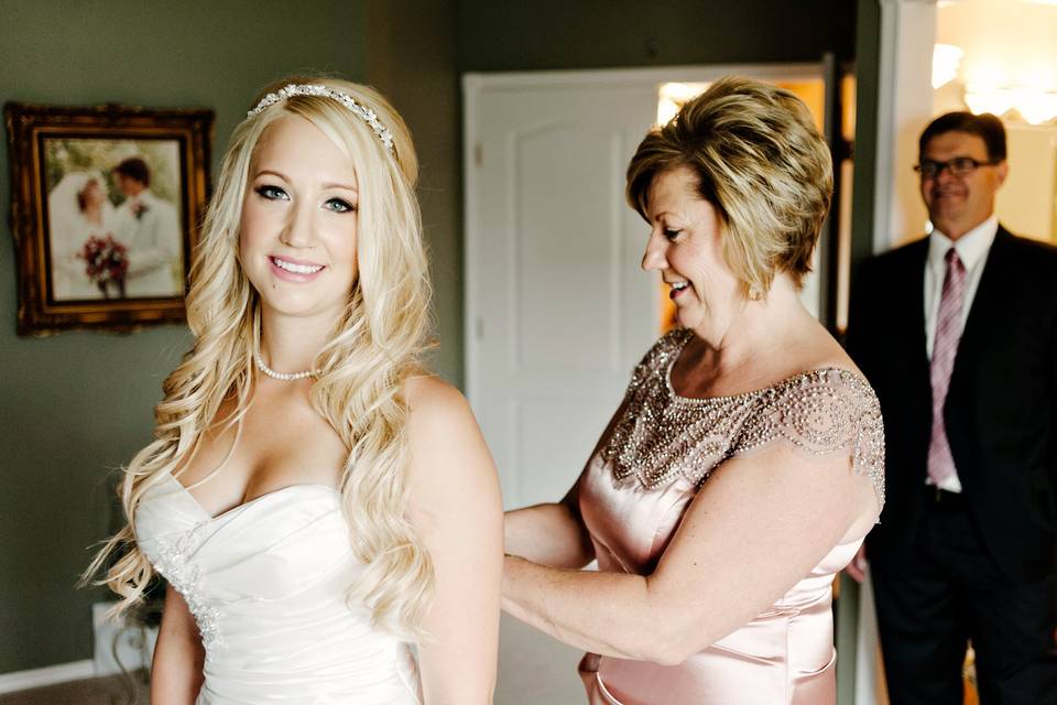 Mother doing brides dress up