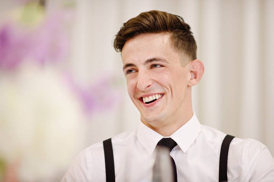 Groom laughing