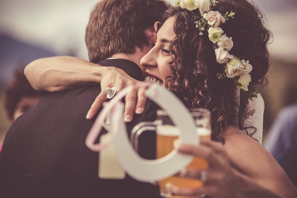 Bride hugging friend