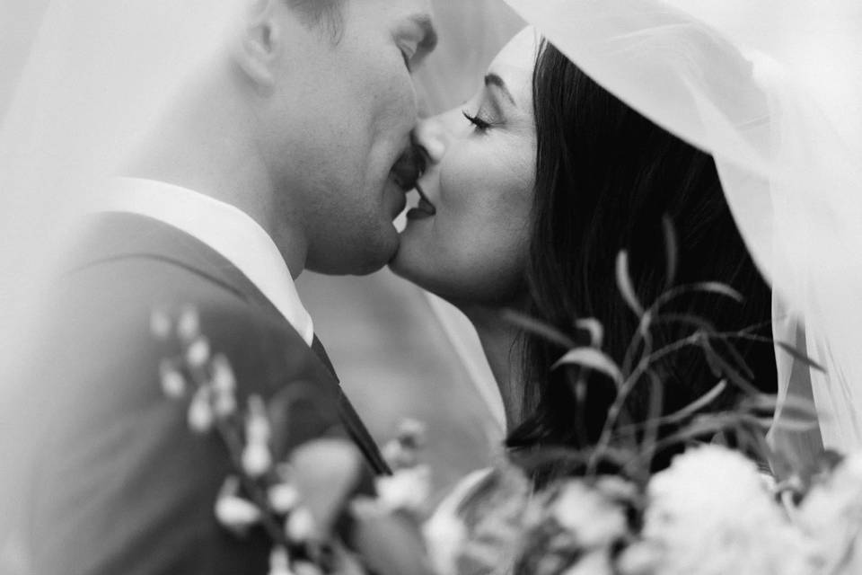 Black-and-white wedding kiss