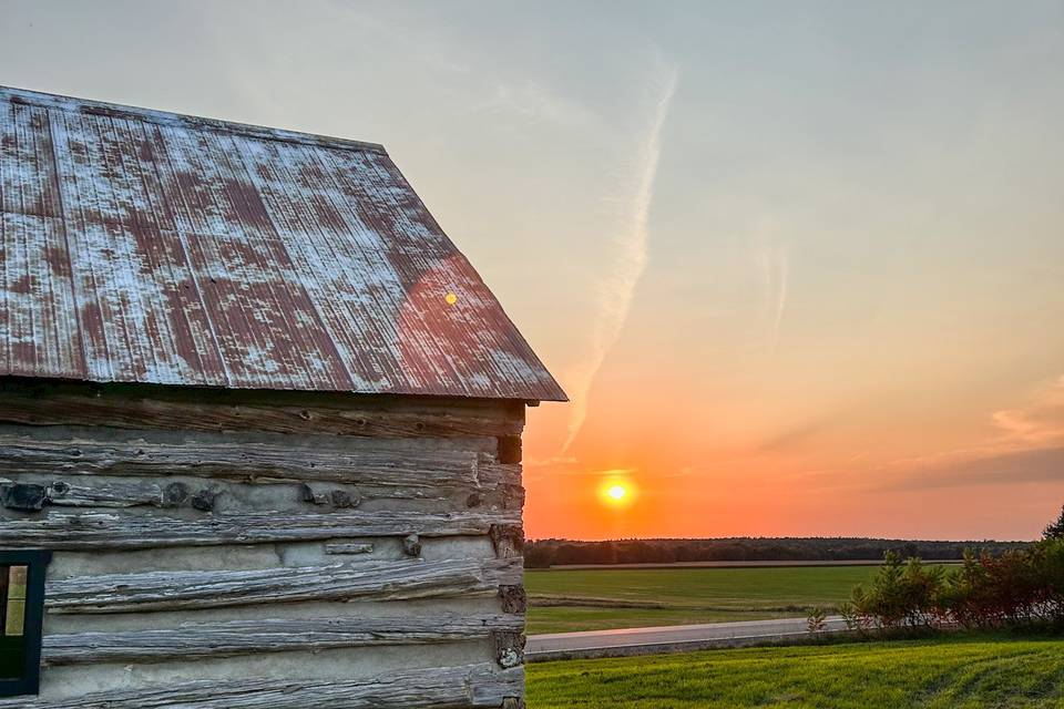 Sunset behind Log Cabin