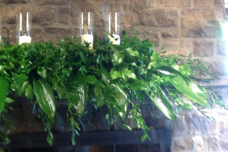 Greenery and candles for firep