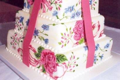 Handpainted wedding cake with bow.jpg