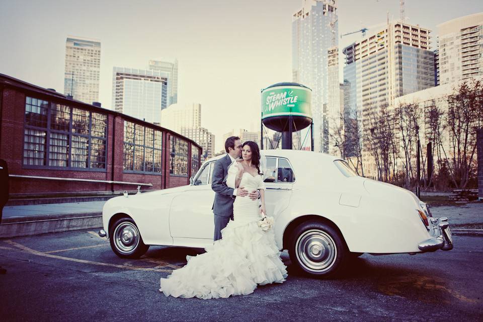 Newlyweds with vintage car