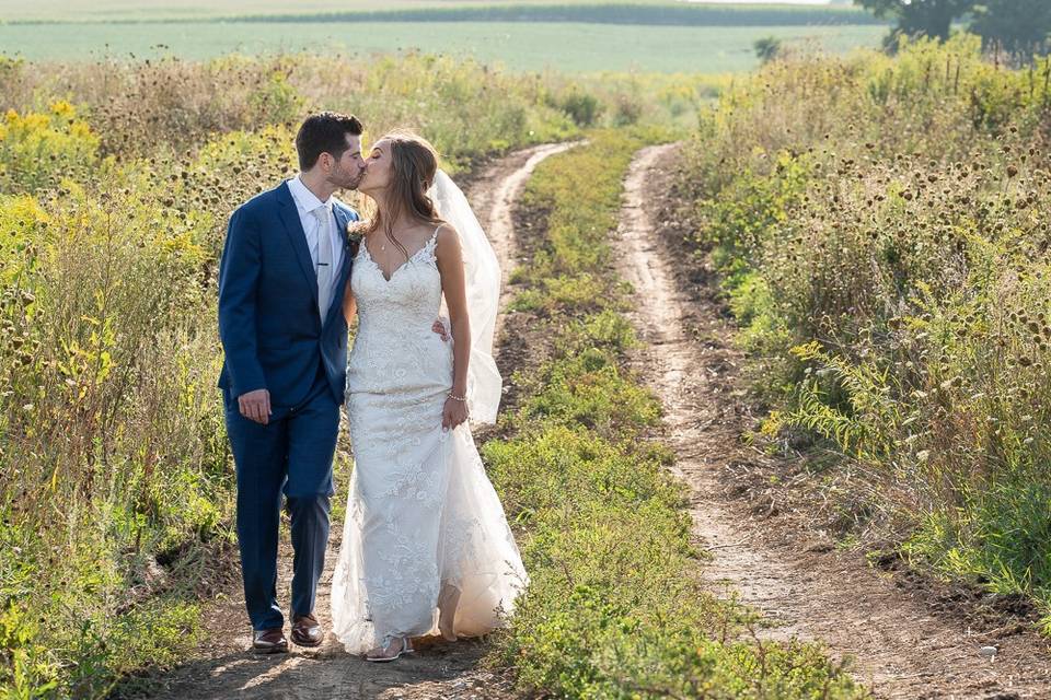 Bride and groom on path