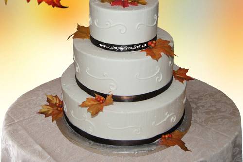 wedding-cake_3-tier-buttercream-brown-ribbon-autumn-leaves.jpg