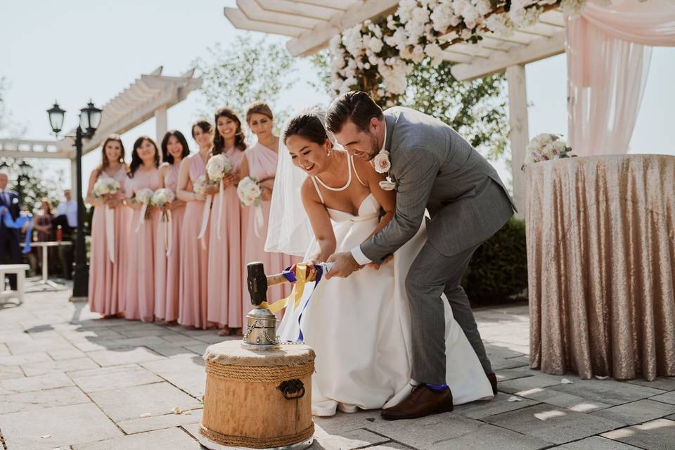 Wedding Couple Striking a Coin