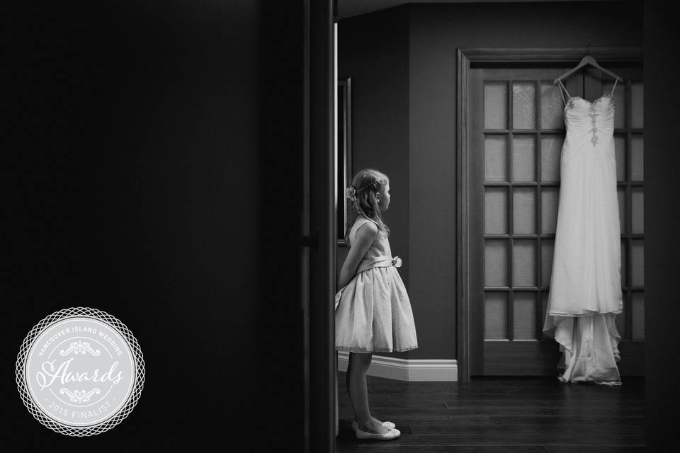 Flower girl looking at dress