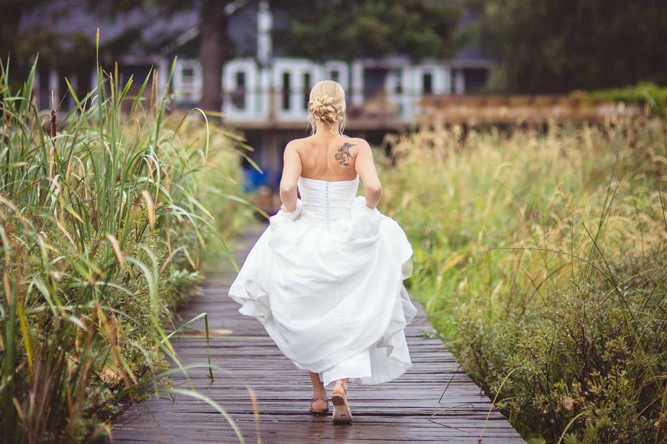 Bride walking on dock