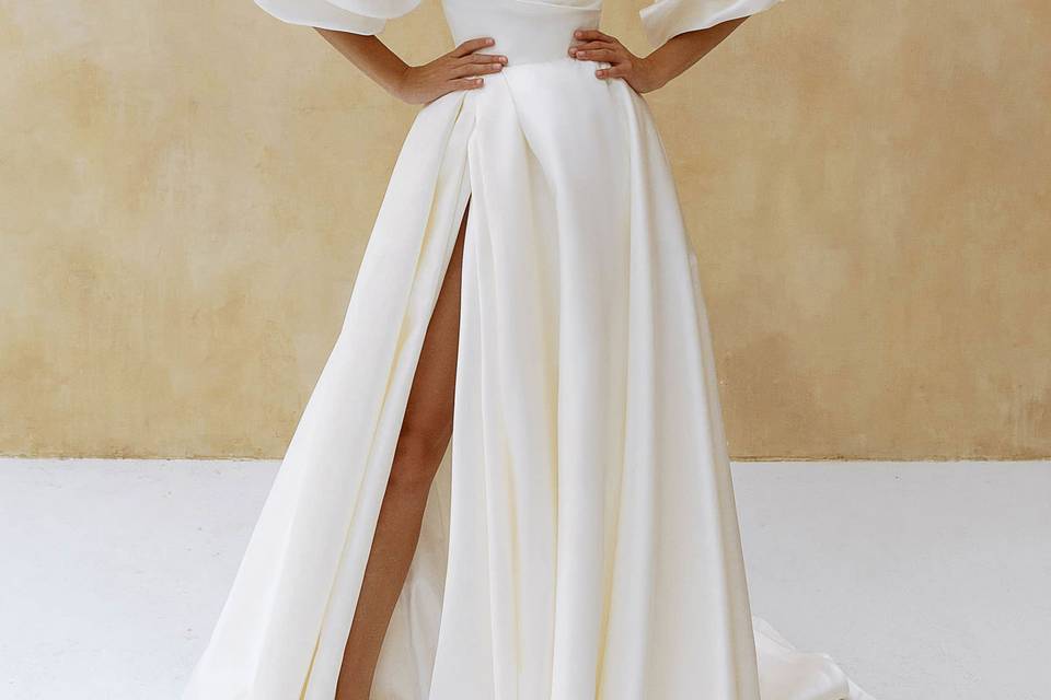 Dramatic gown with bustling sleeves
