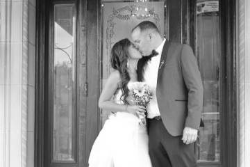 Black and white doorway kiss