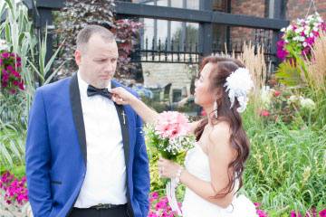 Bride fixing bow tie