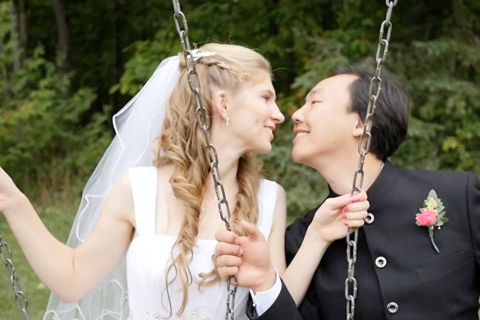 Newlyweds on swings