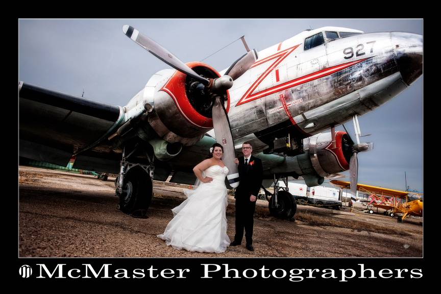 Bride and groom with plane