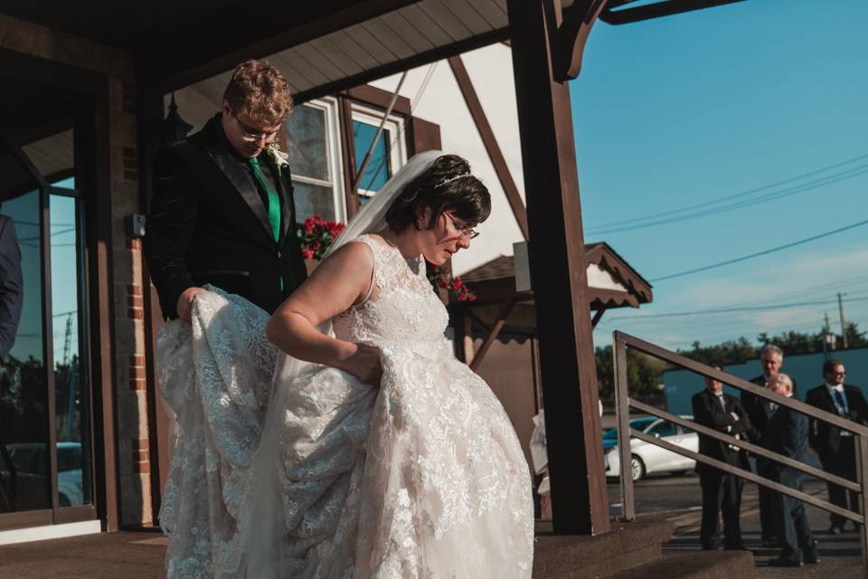 Helping the bride with her dress