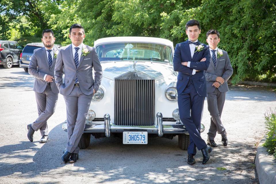 Groomsmen with historic car