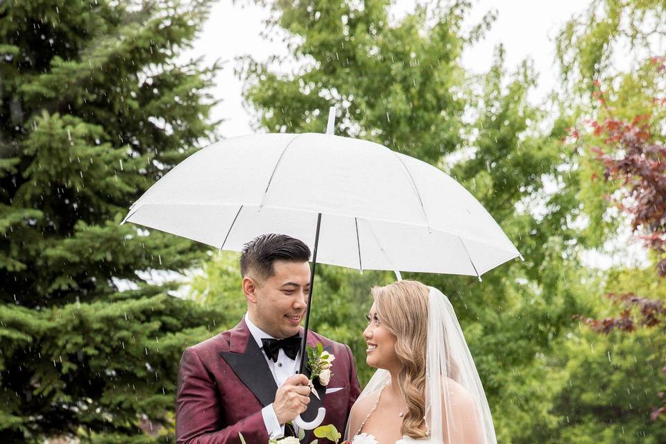 Bride and groom with umbrella