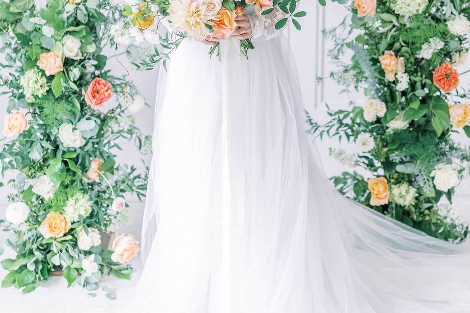 Stunning bride surrounded by flowers