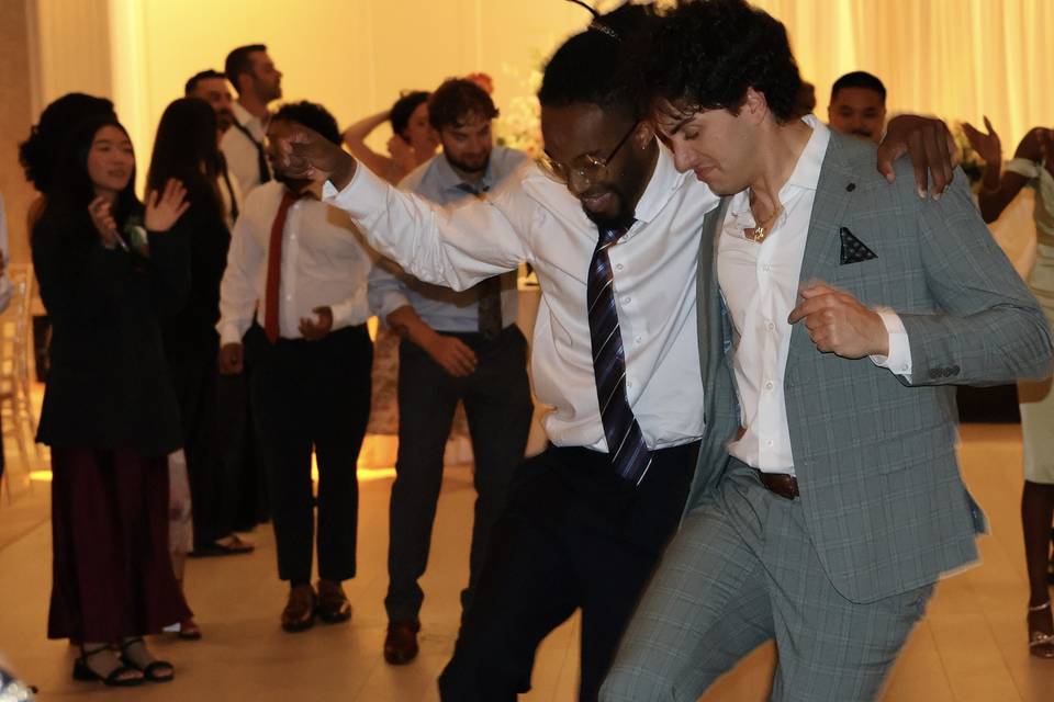 Guys having fun at wedding