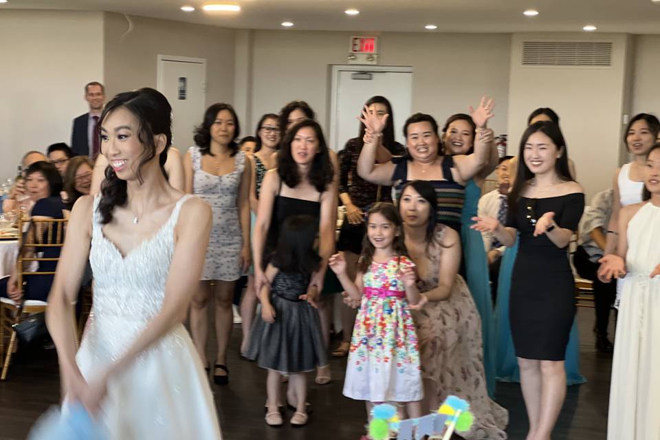 Bride tossing bouquet