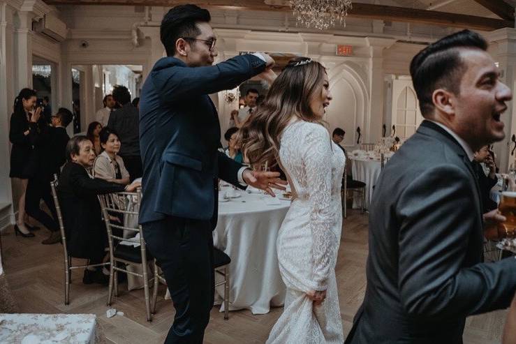 Candid bride and groom dancing