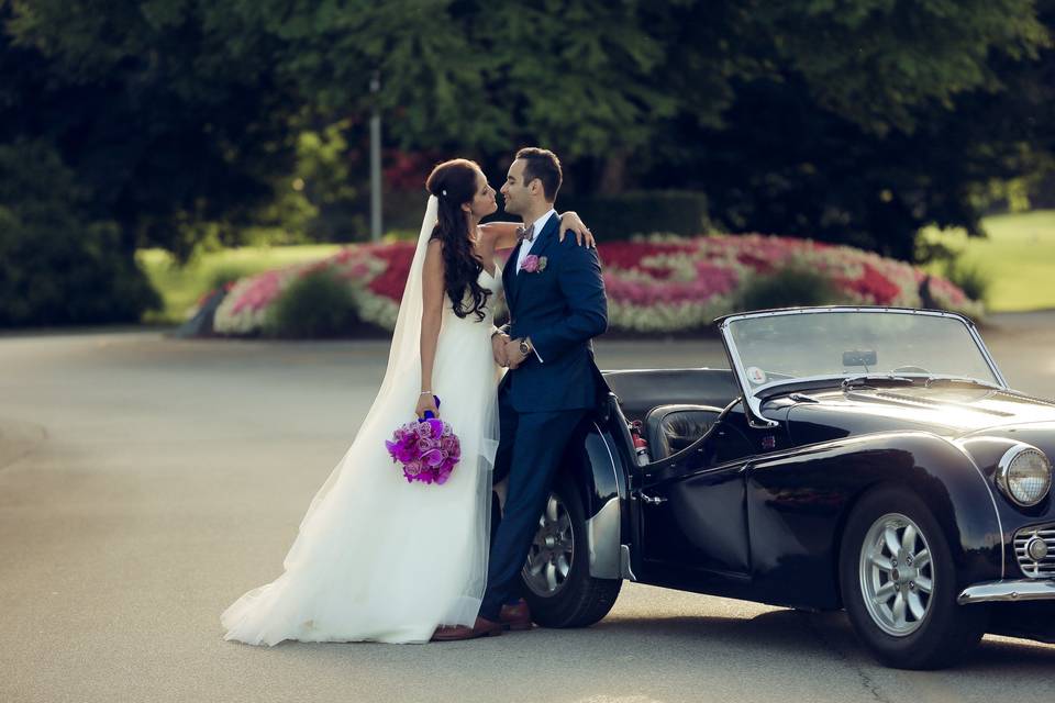 Standing by a vintage car