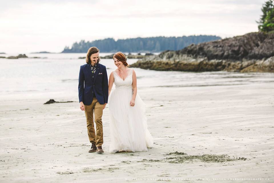 Newlyweds walking the beach