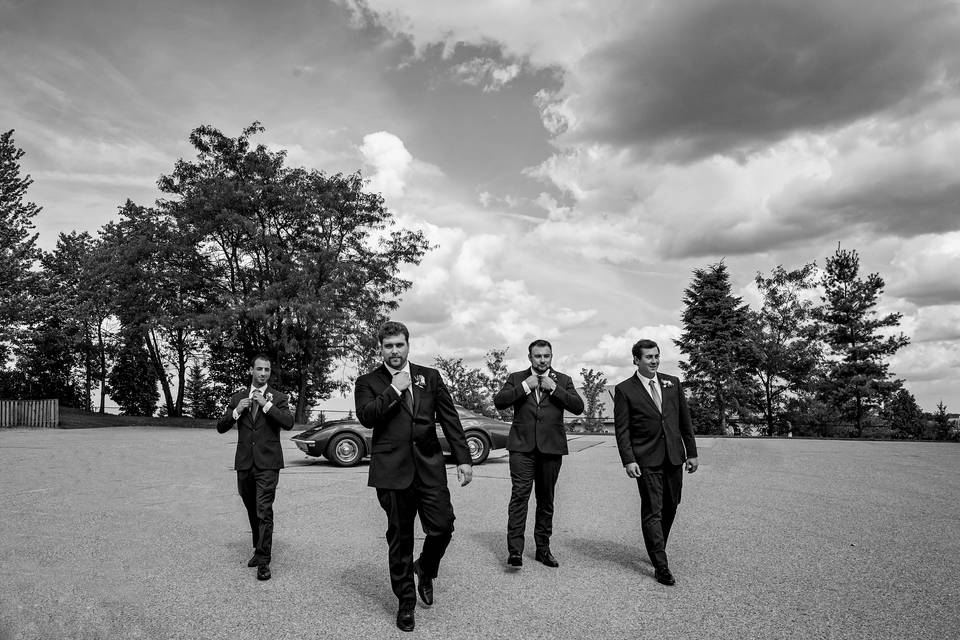 Groomsmen and their car