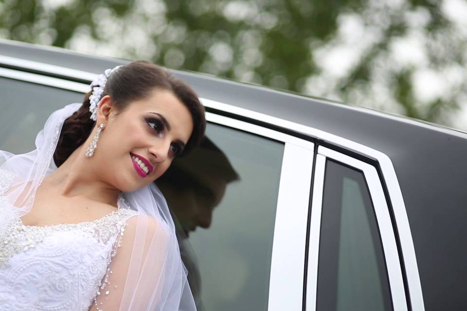 Guest-of-honour smiling by car