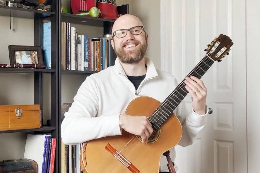 Smiling with guitar