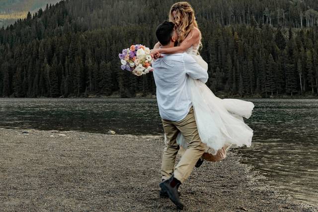 Newly weds dancing in the rain