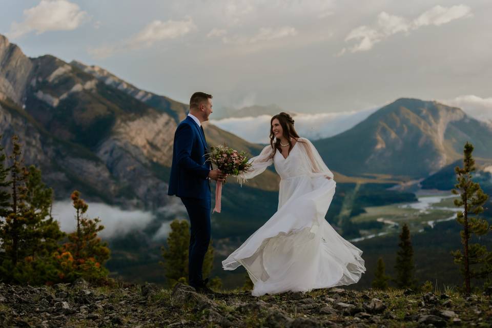 Bride & groom top of mountain