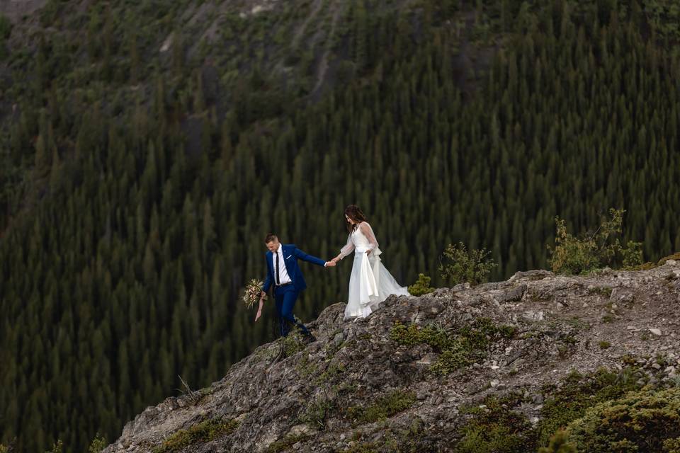 Bride & groom top of mountain