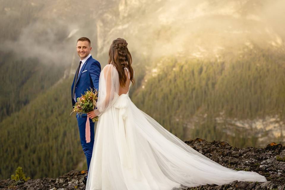 Bride & groom top of mountain