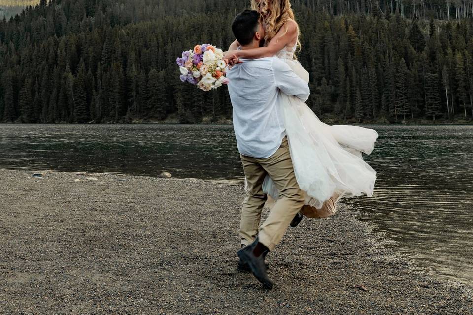 Newly weds dancing in the rain