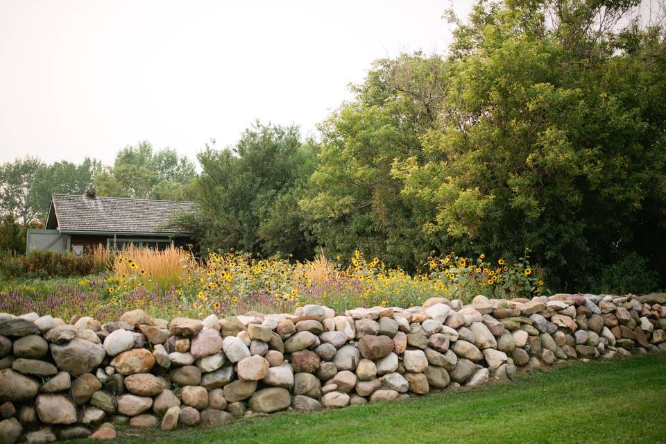 Stone wall and late garden