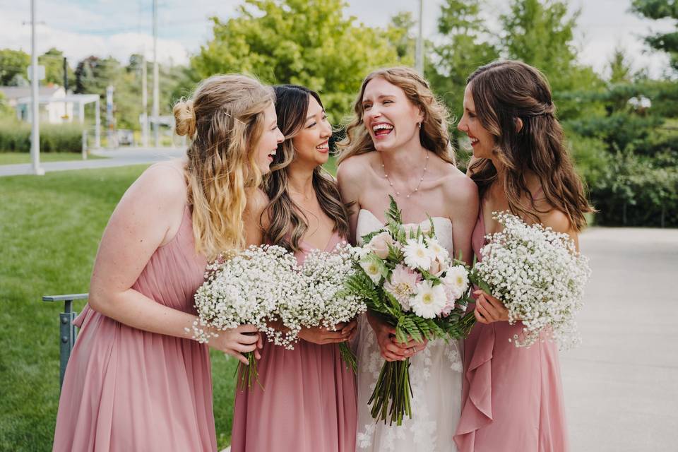 Bridal party laughing.