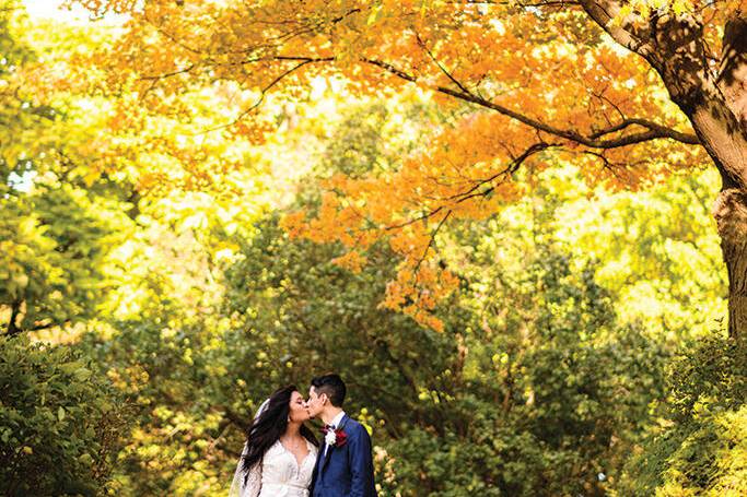 Couple kissing in the fall