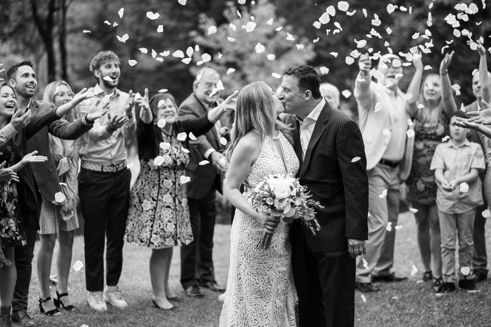 Couple kiss under flower petal